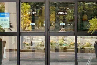 Automatic sliding glass entrance doors